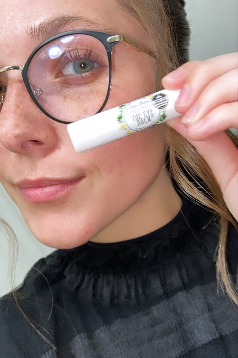 A testimonial photo from a real customer using The Eye Balm™.
