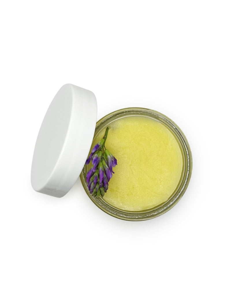 A close-up shot of the Baby & Mom Balm, enlarged to show texture.